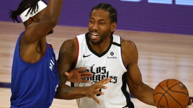 Los Angeles Clippers forward Kawhi Leonard drives against Denver Nuggets forward Jerami Grant during the second round of the 2020 NBA Playoffs at ESPN Wide World of Sports Complex.
